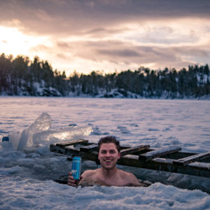 Man in ice lake in norway